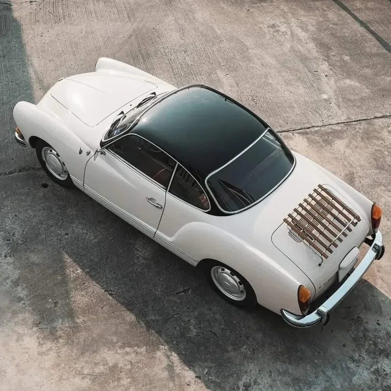 White Karmann Ghia seen from above with a slatted deck-lid rack