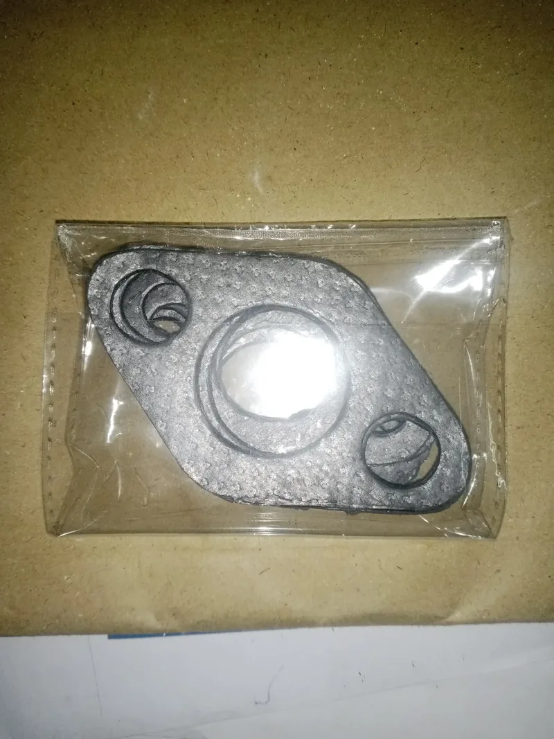 Metal exhaust gasket and small rings sealed in a clear bag