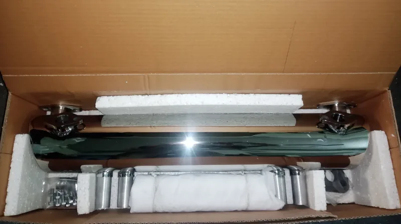 Chrome exhaust assembly and wrapped components packed in an open box