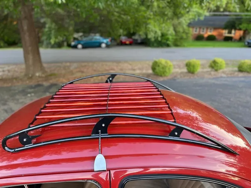 Red-slatted roof rack viewed from above on a red Volkswagen Beetle