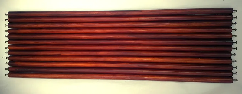 Rows of reddish-brown roof-rack slats with threaded ends