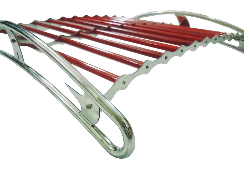 Low-angle close-up of red slats and scalloped supports on a chrome roof rack