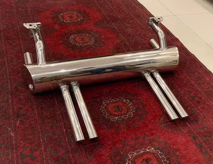 Abarth style exhaust and deck-lid rack hardware detail