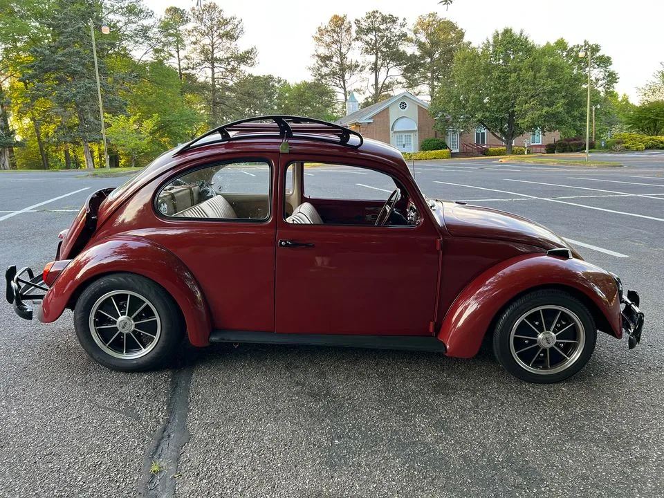 Red VW Beetle side profile with speed roof rack installed