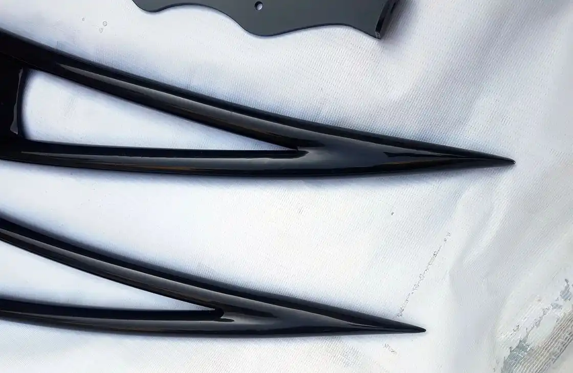 Black speed roof rack hardware and slat detail on white cloth