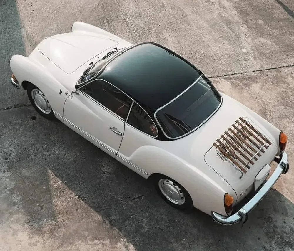 White Karmann Ghia viewed from above with a slatted deck-lid rack