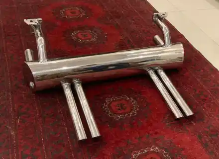 Abarth style exhaust and deck-lid rack hardware detail